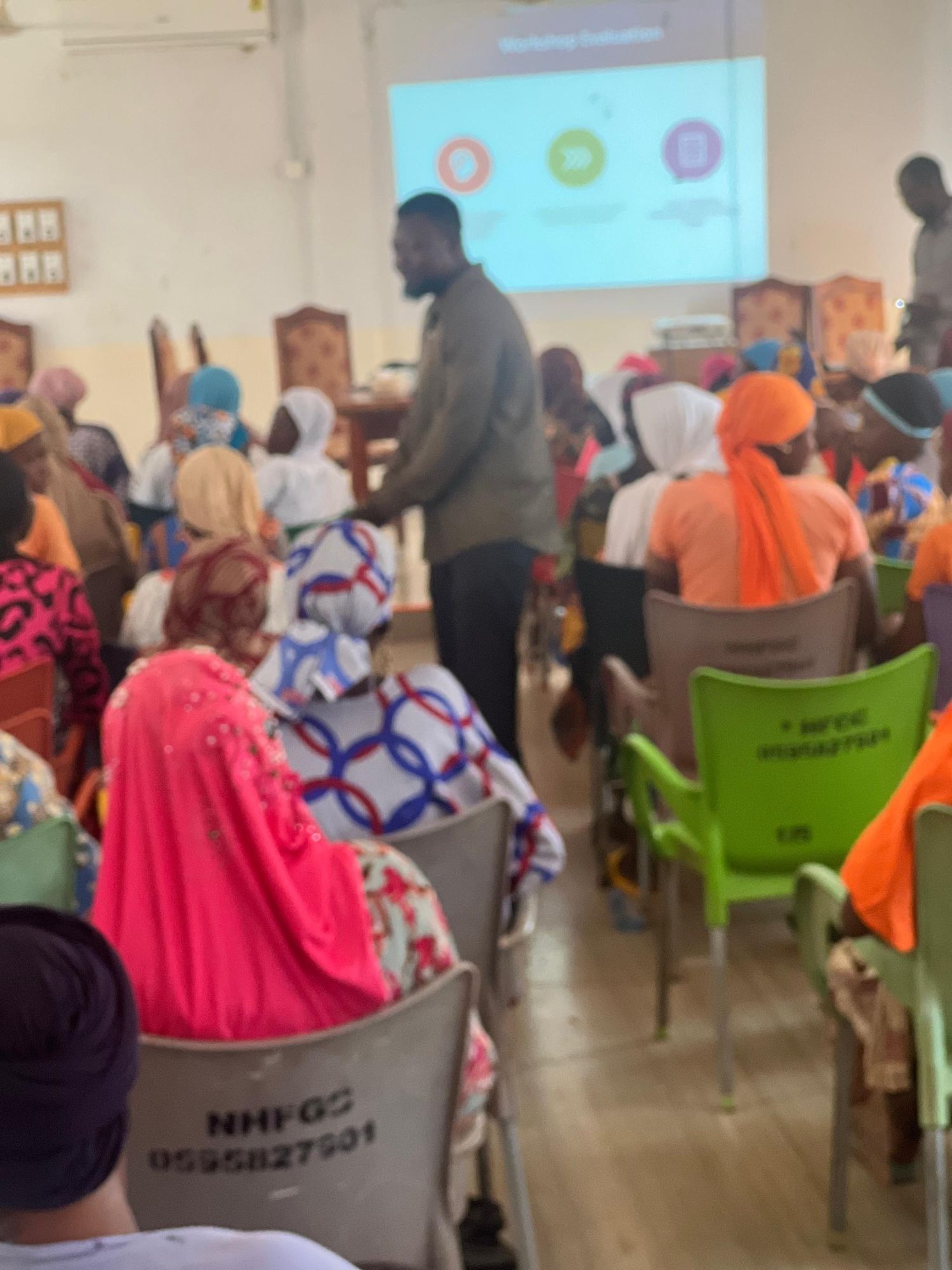 Wide view of community workshop attended by women