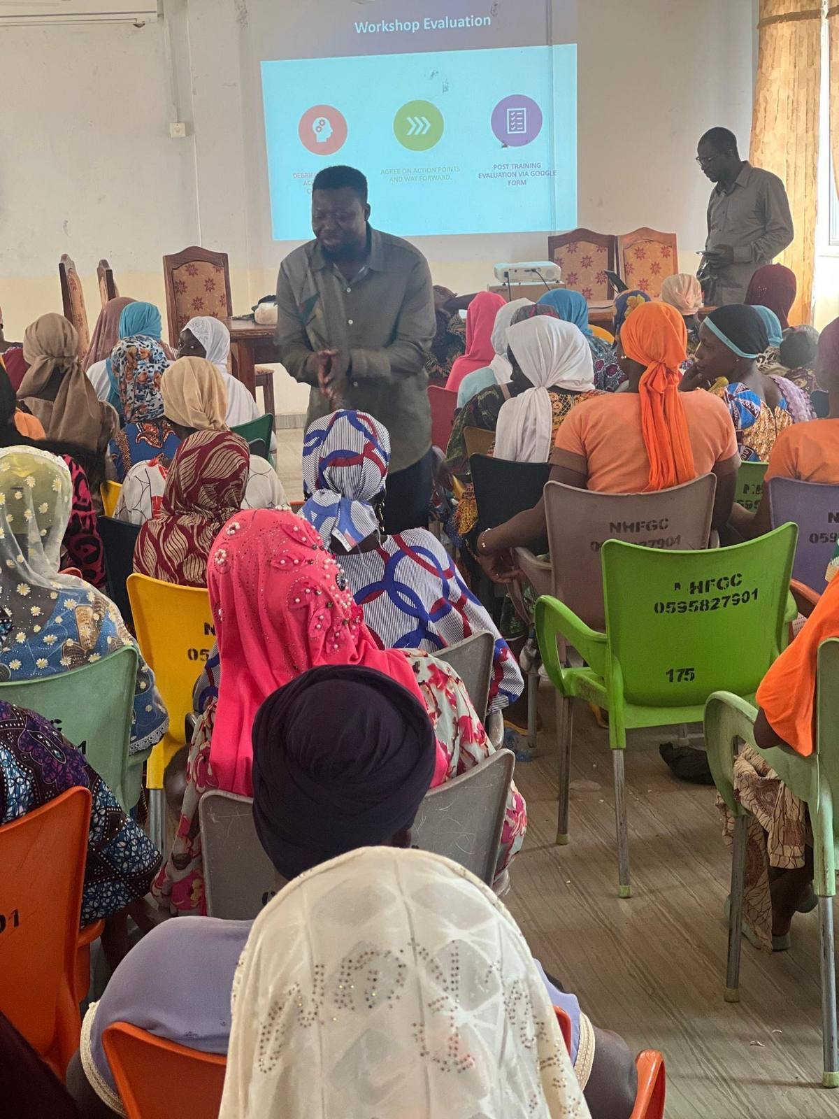 Facilitator engaging participants during workshop evaluation