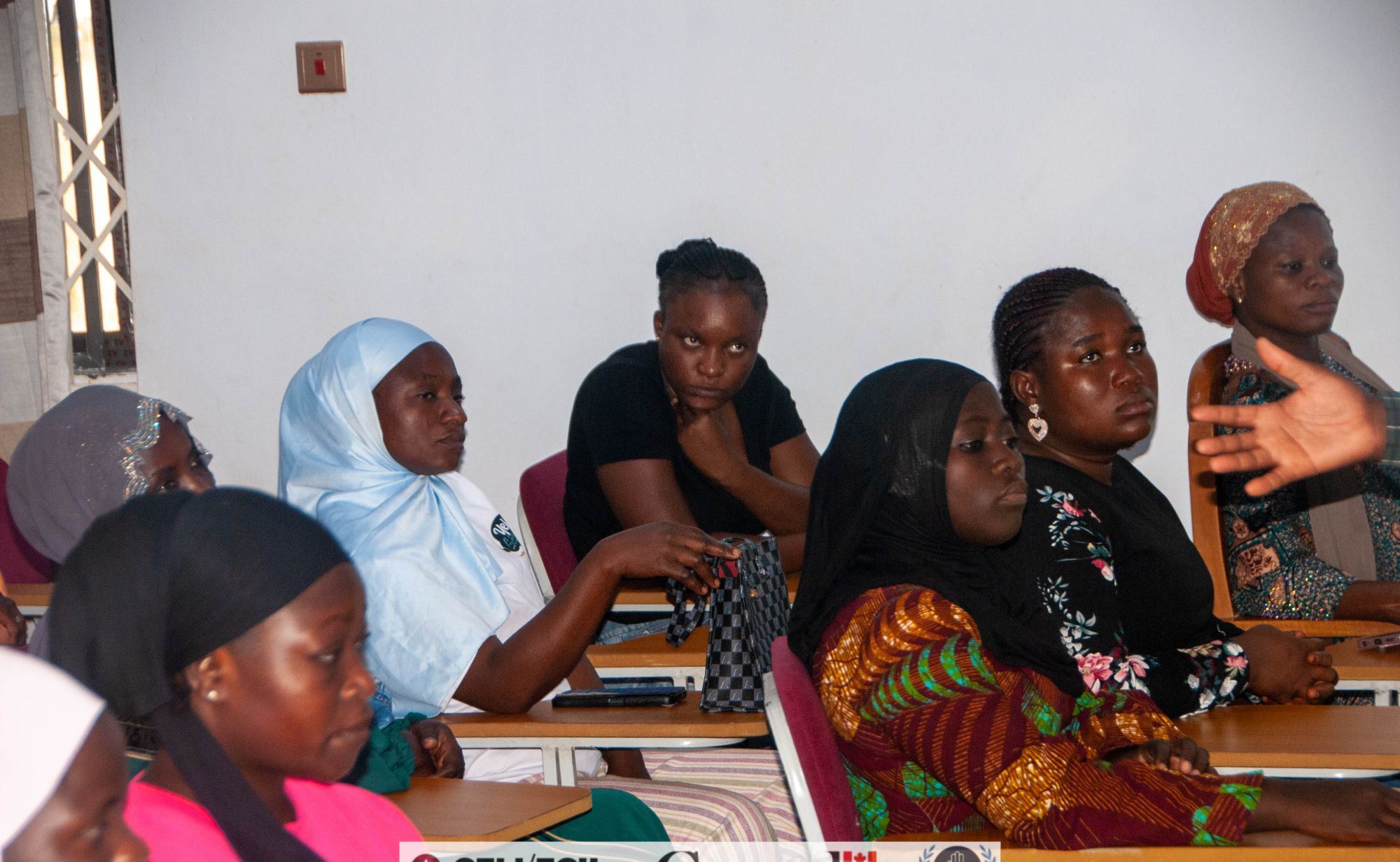 Women participants listening attentively at a workshop