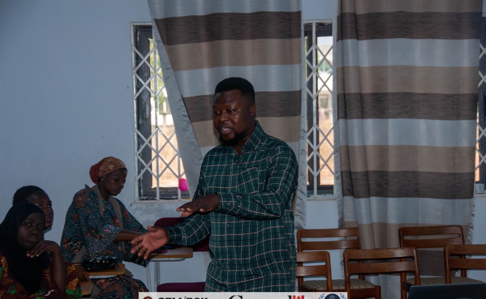 Facilitator in conversation with workshop participants
